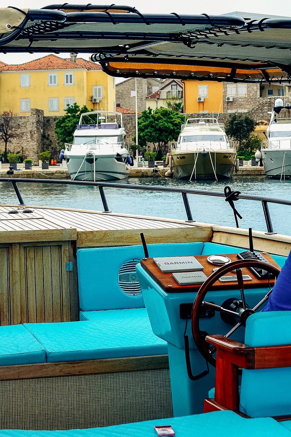 Helm details with marina in background